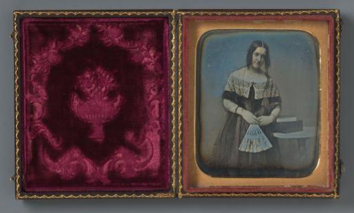 Portrait of an unknown woman with a fan