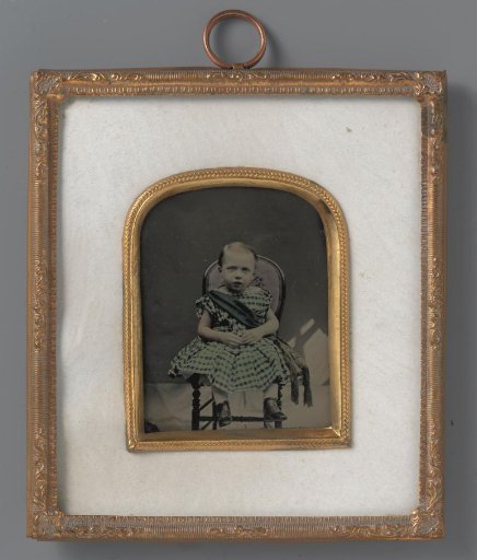 Portrait of an unknown seated girl