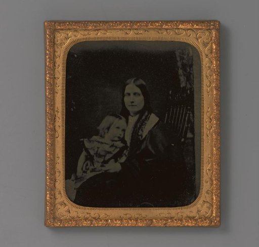 Portrait of an unknown woman with a child on her lap