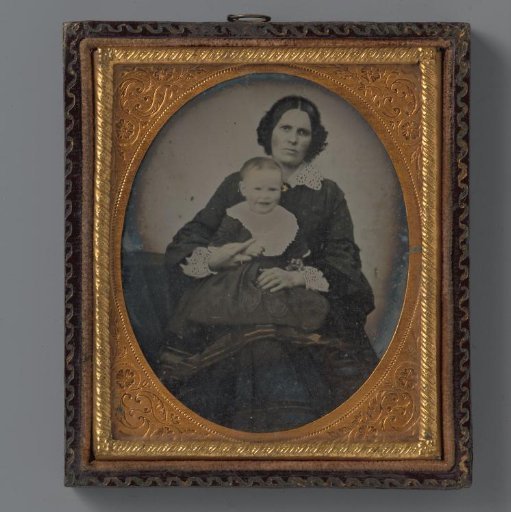 Portrait of an unknown woman with a child on her lap