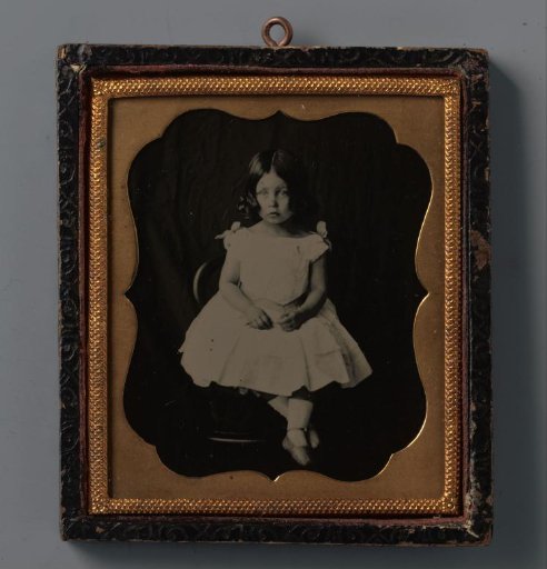 Portrait of an unknown seated girl