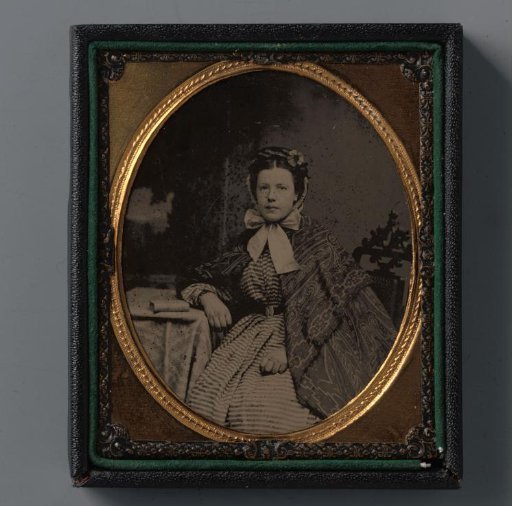 Portrait of an unknown seated girl
