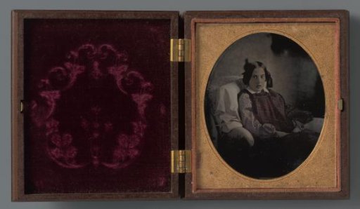 Portrait of an unknown sitting girl