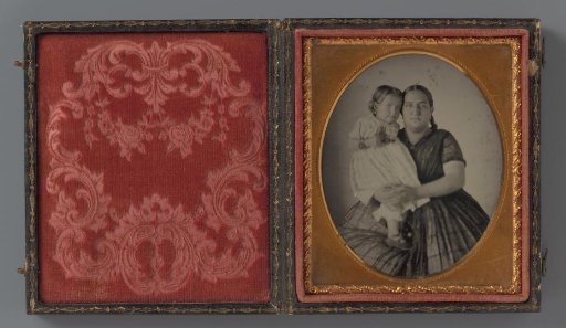 Portrait of an unknown woman with a child in her arms