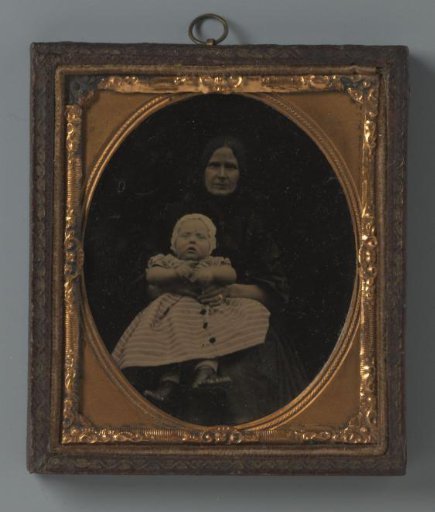 Portrait of an unknown woman with a child on her lap