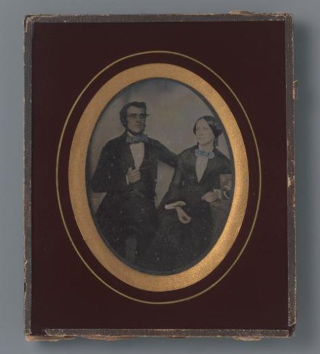 Portrait of an unknown couple with photograph