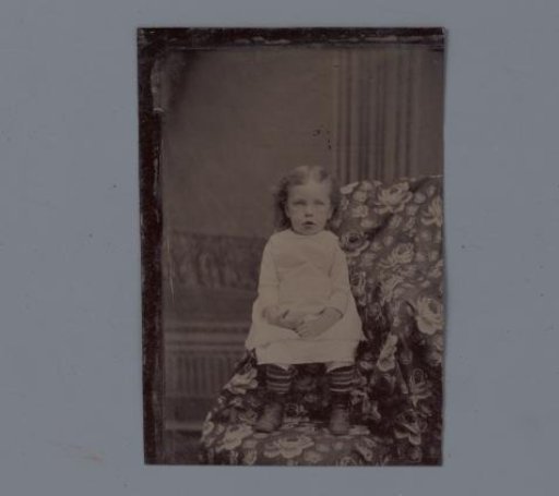 Portrait of an unknown seated girl