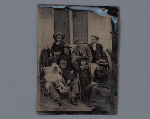 Family portrait of an unknown man, woman and six children