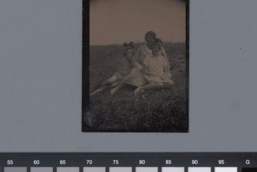 Portrait of an unknown seated woman and two unknown girls