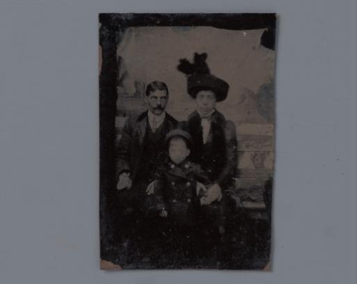 Portrait of an unknown married couple with child