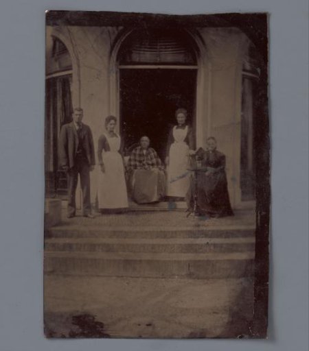 Portrait of an unknown family on a staircase
