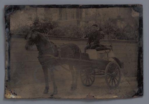 Portrait of an unknown young man on a carriage