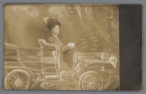 Portrait of an unknown woman in a setting with a painted car
