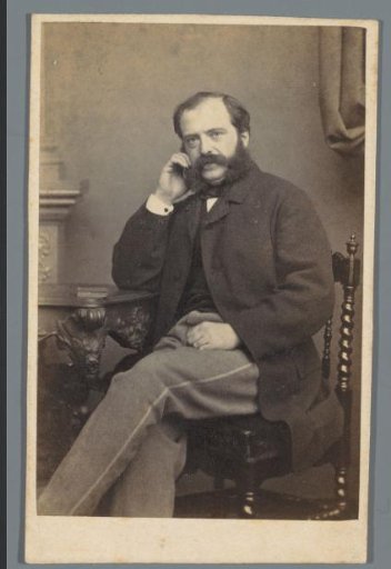 Portrait of an unknown man, seated at a table