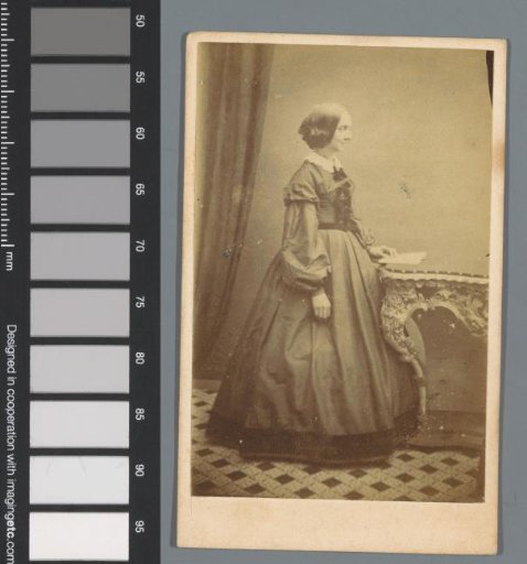 Portrait of an Unknown Woman, Standing Beside a Table with a Book