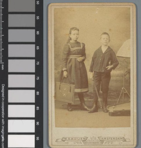 Portrait of an unknown girl and an unknown boy with a violin under his arm