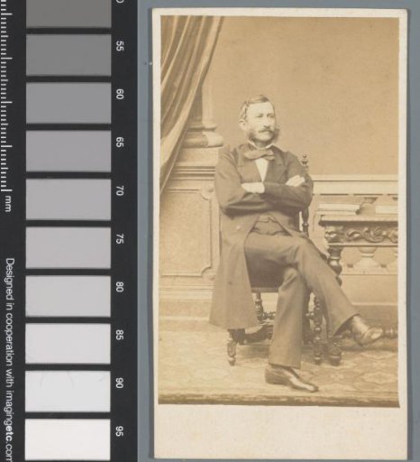 Portrait of an unknown man at a table