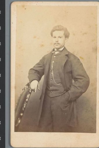 Portrait of an unknown man, standing next to a chair