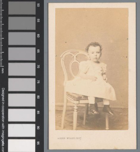 Portrait of an unknown child, seated on a chair