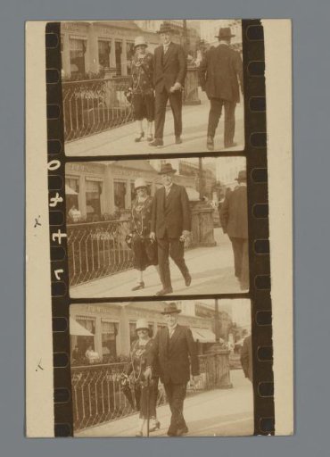 Postcard with three film frames of an unknown man and a woman on the street