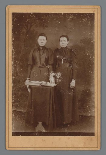 Portrait of Two Unknown Women with a Photo Album