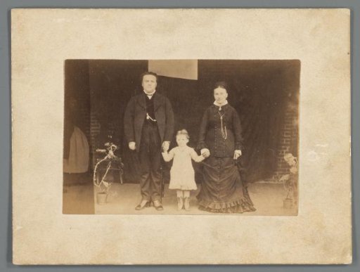 Group Portrait of an Unknown Man, Woman and Child, Standing Hand in Hand