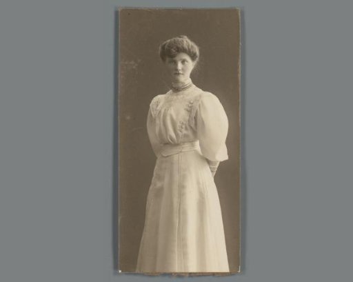 Portrait of an unknown young woman in a dress