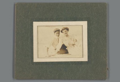 Portrait of an unknown young couple outdoors; framed in a cardboard frame