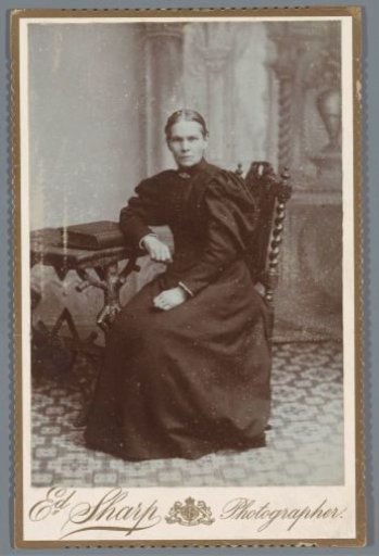 Studio portrait of a seated woman