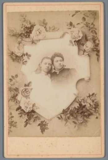Portrait of an unknown mother and daughter in a frame with flowers