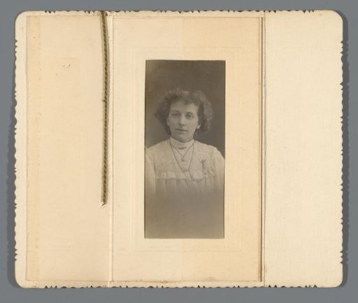 Christmas and New Year's greeting for the year 1910 with portrait of a young woman named Ethel