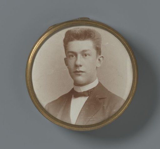 Portrait of an unknown young man, on the lid of a metal powder compact
