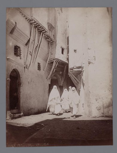Four unknown veiled women on the street in Algiers