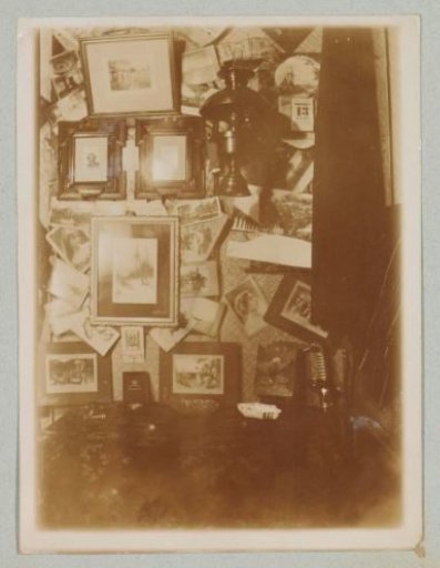 Photo wall in cabin on board the Gelderland, 1901
