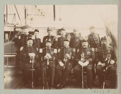 Group portrait of unknown Dutch marines in uniform on the deck of the H.M. Neptunus