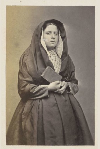 Portrait of an unknown woman, possibly from Antwerp, in traditional dress with a Bible in her hand