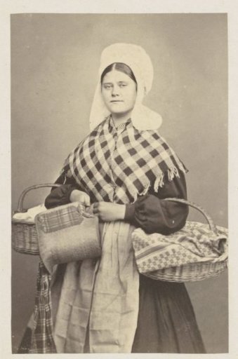 Portrait of an unknown woman, possibly from Antwerp, in traditional dress with baskets in her arms