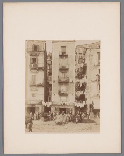 Street view in Santa Lucia with laundry between the buildings, Naples, Italy