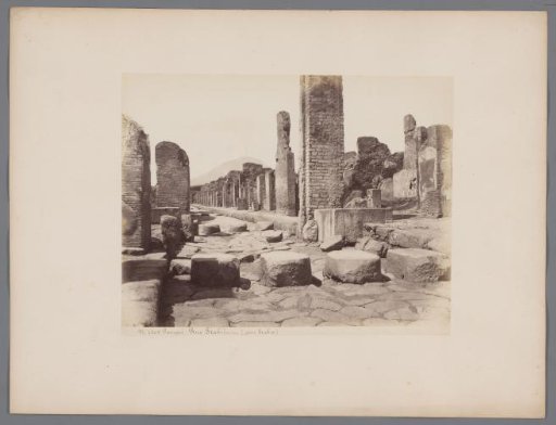 Remains of a street in Pompeii, viewed towards Vesuvius, Italy