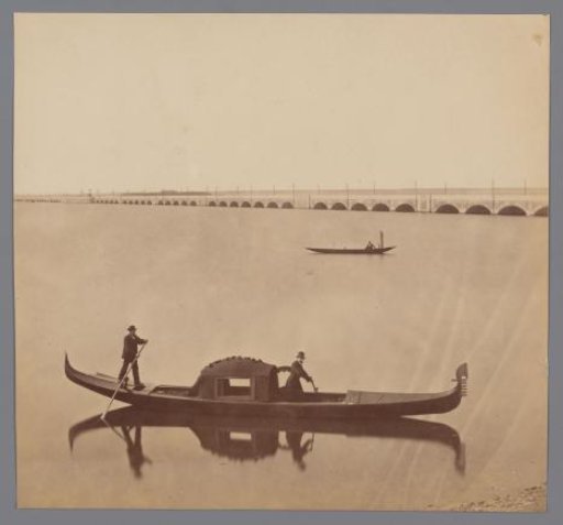 Two gondolas and the railway line between Venice and the mainland