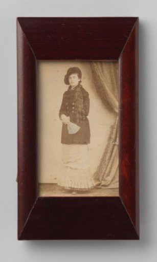 Portrait of an unknown woman holding a fan
