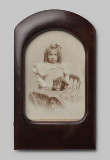 Portrait of an Unknown Girl and a Cat on a Table