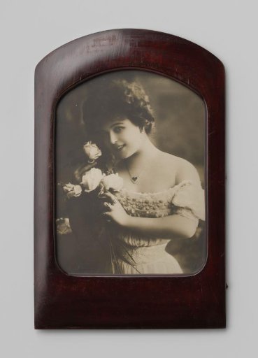 Portrait of an unknown woman with a bouquet of roses
