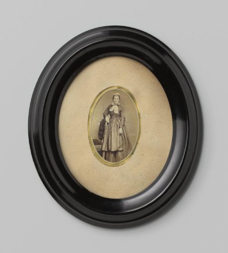 Portrait of an unknown woman leaning on the back of a chair
