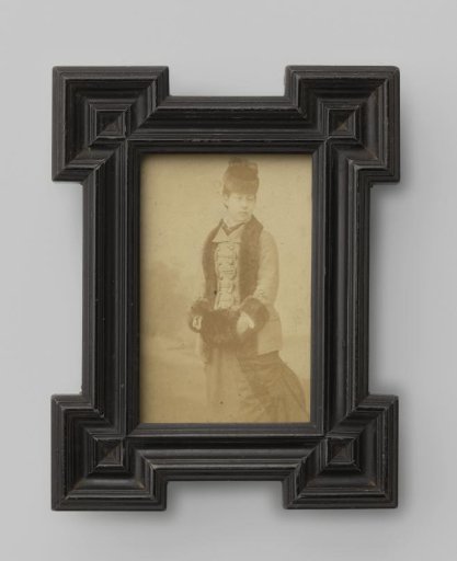 Portrait of an unknown woman with her hands in a muff