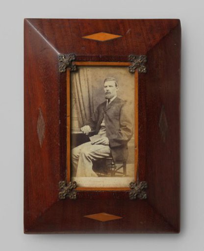 Portrait of an unknown seated man with a book in his hands