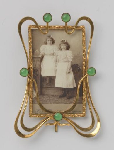 Portrait of two unknown girls standing in dresses