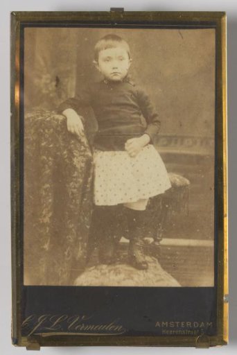Portrait of an unknown girl with a skirt on a chair