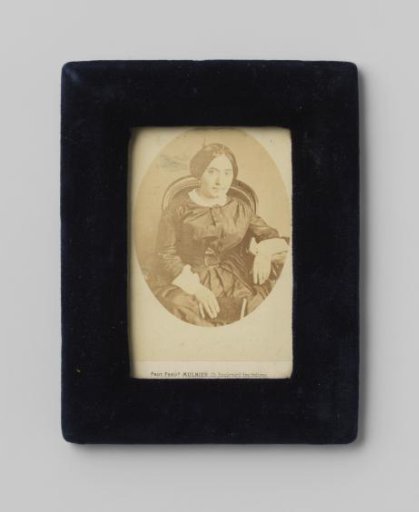Portrait of an unknown woman in a chair