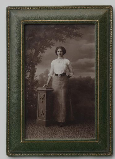 Portrait of an Unknown Standing Woman by a Pedestal